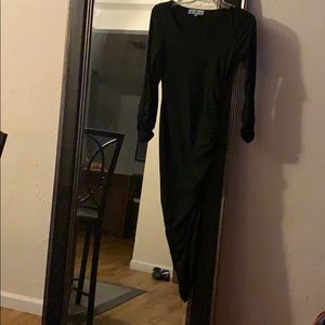 All black dress w ruffles going up the side